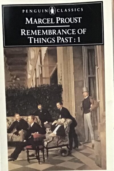 A group of well dressed men in suits and top hats on a terrace